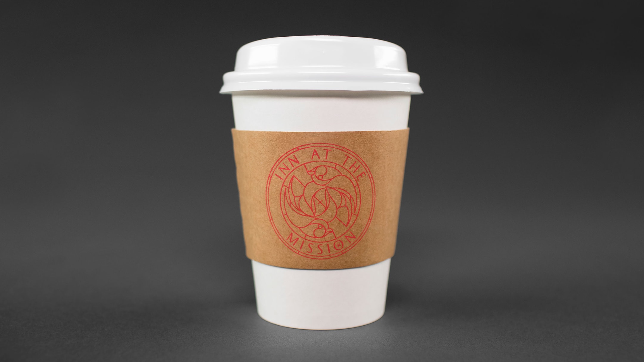 Inn At The Mission branded coffee sleeve