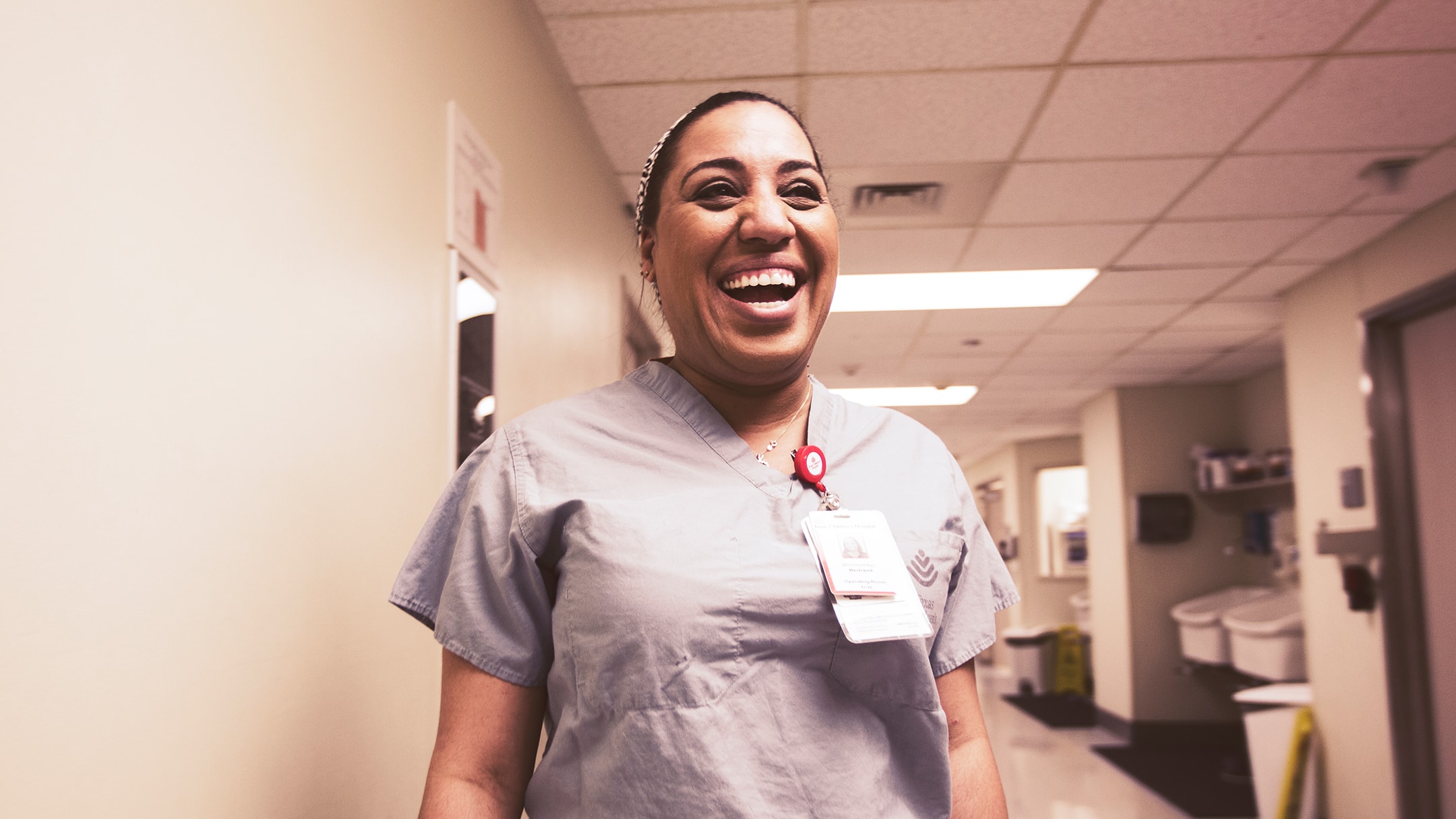 Texas Children’s Hospital nurse smiling excitedly. - Texas Children's Human Resource Campaign and Healthcare marketing initiatives