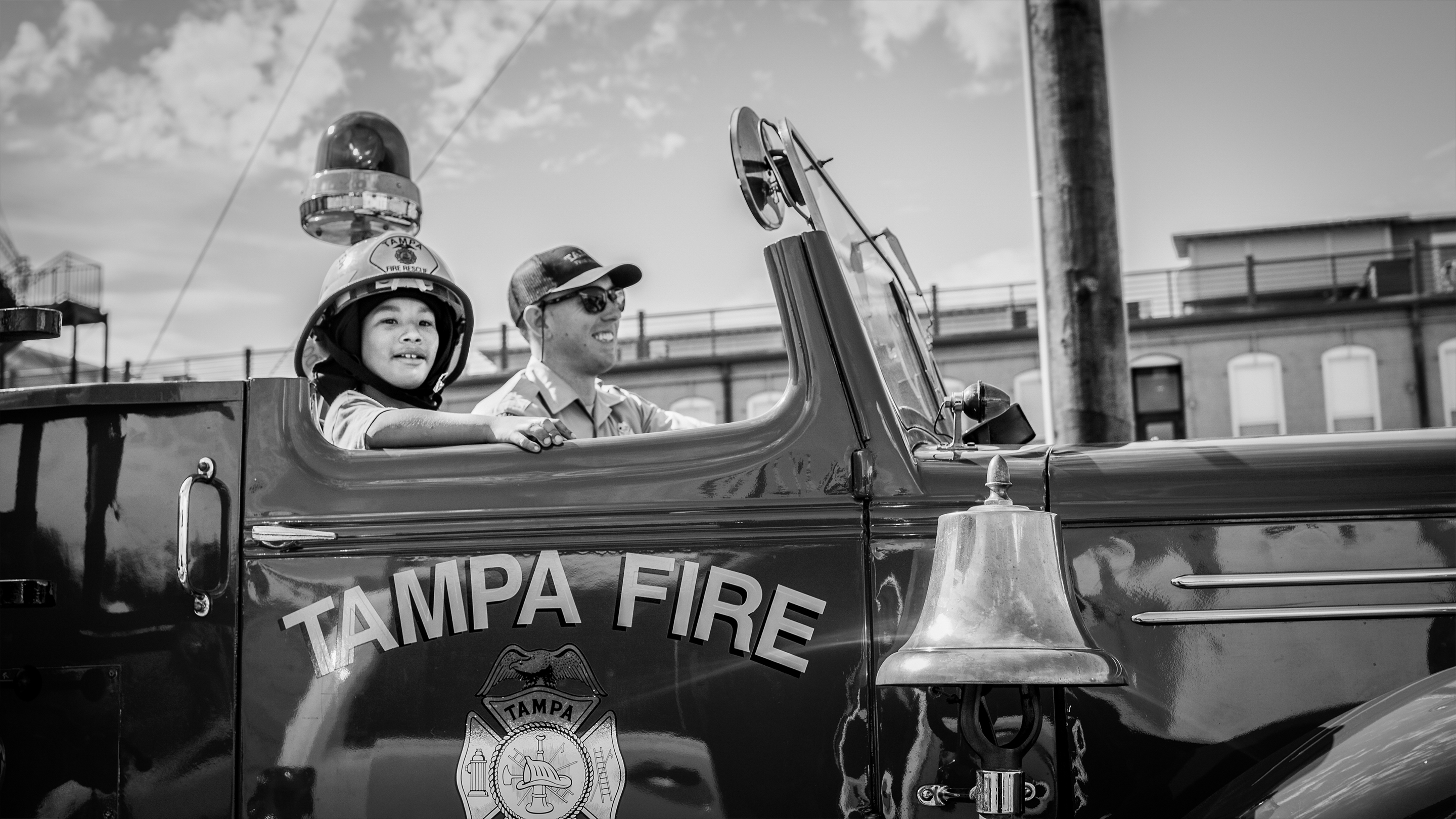 Make-A-Wish Boy Riding In Fire Truck