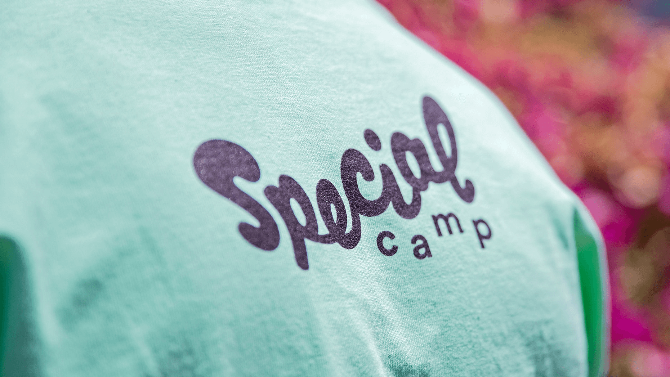 A hand holding up the special camp business card —from our nonprofit rebrand intiative, STOKED.