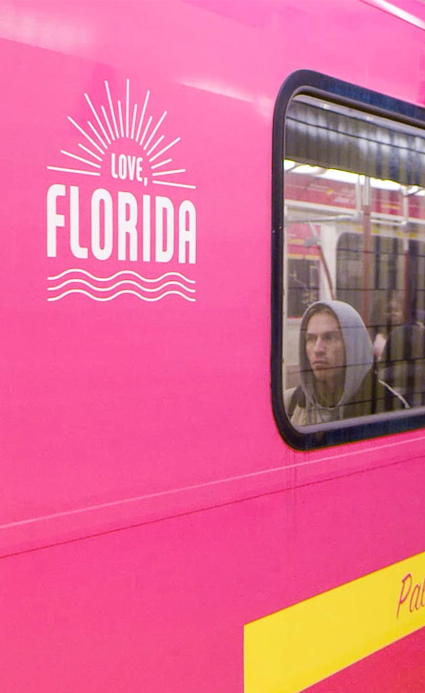 Subway train wrapped in bright pink for VISIT FLORIDA's sunshine line tourism marketing campaign