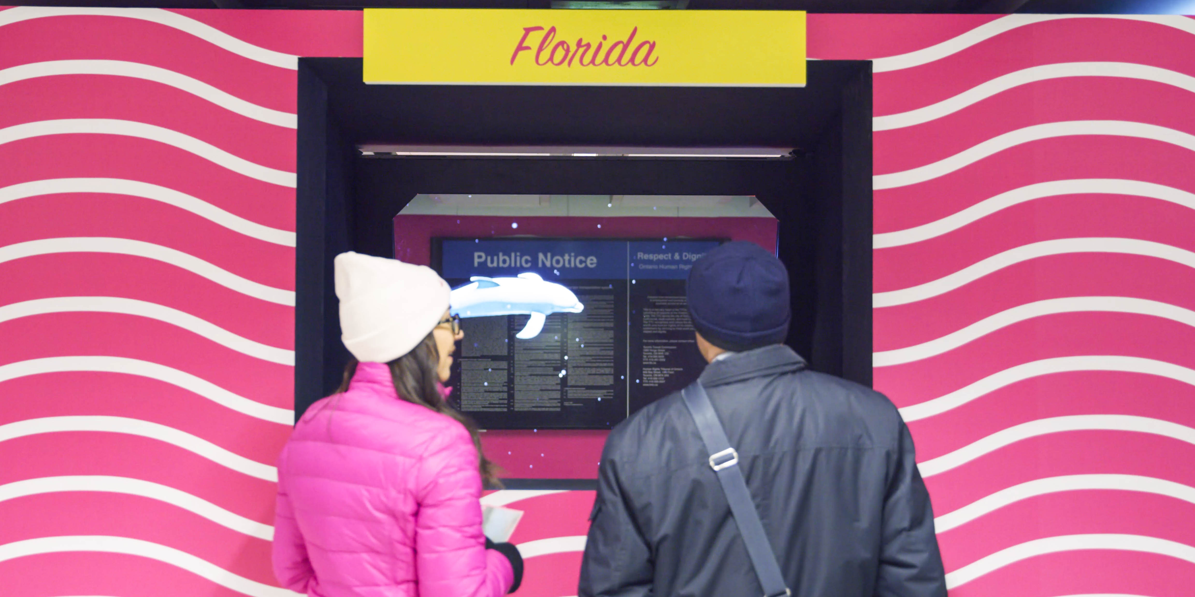 Hologram of a dolphin swimming in the station